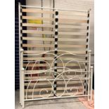 A modern cream painted metal double bed frame and