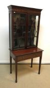 An Edwardian mahogany display cabinet, the two gla