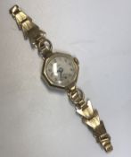 A 9 carat gold cased Avia ladies watch with 9 carat gold plated bracelet