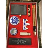 A modern Chinese calligraphy set with six brush pens, ink stone, pen rests, seal, etc, in fabric