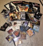 A box containing a collection of various IRON MAIDEN ephemera including VHS videos "Life After