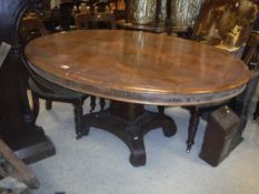 A Victorian rosewood centre table, the oval top wi