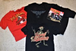 A collection of four various band t-shirts including SAXON "Castle Donnington 1980-2012", DEF