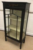 An Edwardian mahogany and satinwood strung single door display cabinet with painted decorated
