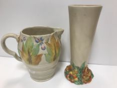 A Clarice Cliff Wilkinson trumpet shaped vase on floral decorated relief work base 27 cm high