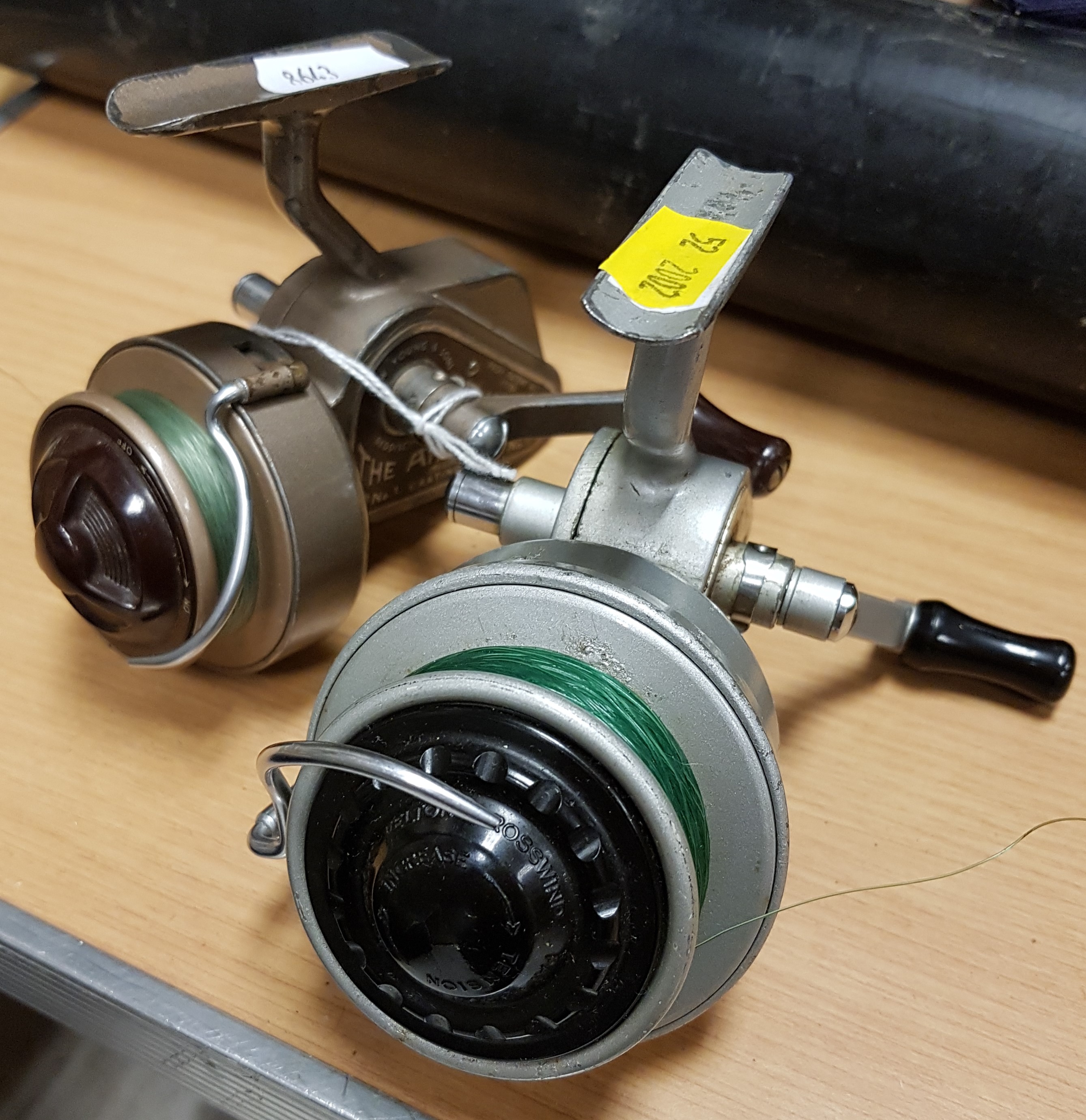 An Allcock "Felton Crosswind" No. 2 fixed spool reel 11.5 cm and an Ambidex No. 1 fixed spool reel