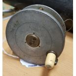 A Hardy "Field" 31/8" contracted trout fly reel, bearing rod in hand trademark 8 cmCondition