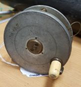 A Hardy "Field" 31/8" contracted trout fly reel, bearing rod in hand trademark 8 cmCondition