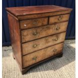 An oak chest in the early 18th Century manner, the plain top over two short and three long walnut