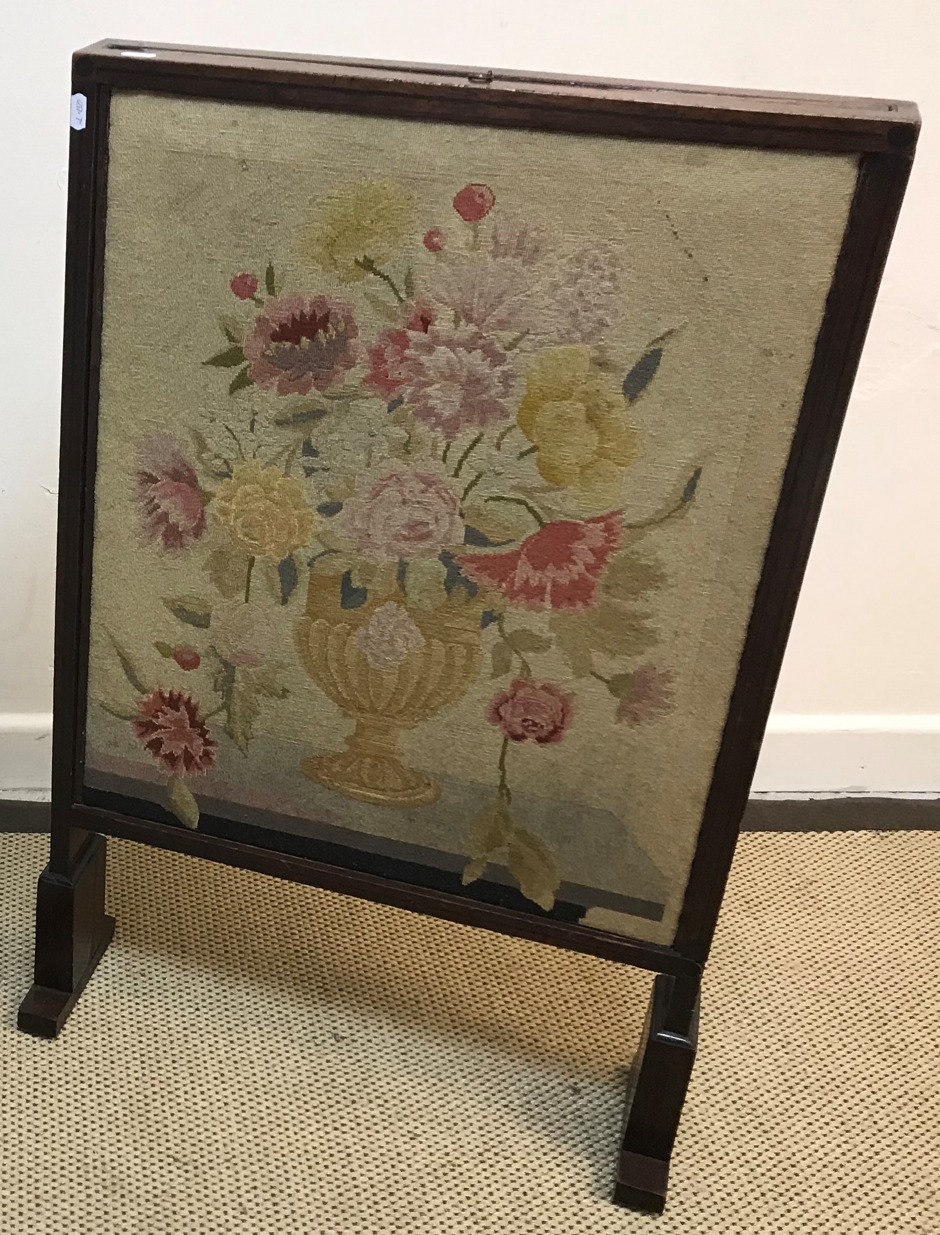 A 19th Century Scottish mahogany framed fire screen with adjustable side panels and top panel, the