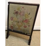 A 19th Century Scottish mahogany framed fire screen with adjustable side panels and top panel, the