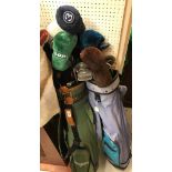 Two golf bags and contents of Hippo, Wilson and other irons, various woods, etc (30 total)