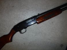 A Mossberg 500A 12 bore shotgun, pump action, together with a Birmingham Gun Barrel Proof House