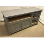 A modern painted dwarf side cabinet, the