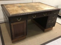 A mahogany partner's desk, the top with