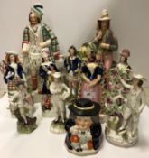 Eleven various 19th Century Staffordshire figures including Scotsman in formal kilt dress 38 cm