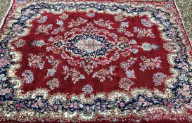 A Kirman carpet, the central panel set w