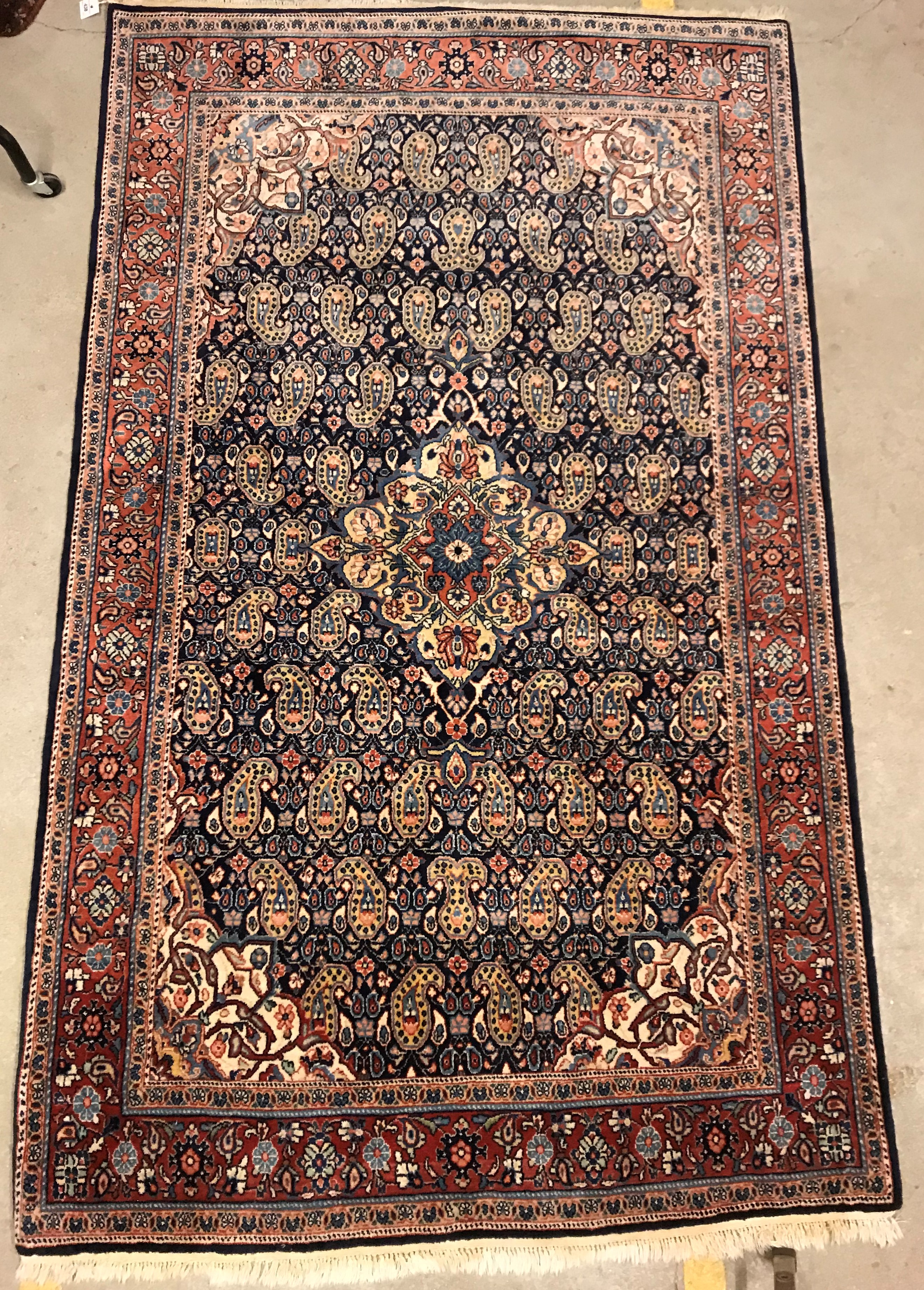 A Kashan carpet, the central panel set w