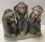 A Lladro figure group of three monkeys "