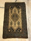 A Caucasian rug, the central panel set w