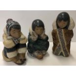 Three Lladro figures of "Seated children