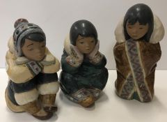 Three Lladro figures of "Seated children