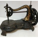 A Jones cast iron sewing machine with gi