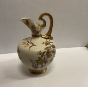 A Royal Worcester blushware jug with flo