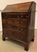 A 19th Century mahogany bureau, the slop