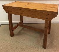 A modern pine work bench with plank top