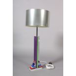 A perspex table lamp of column form, with multicoloured column and base, 48cm high, with silvered