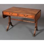 A cherrywood sofa table of 18th century style crossbanded and strung with radiating veneers, twin