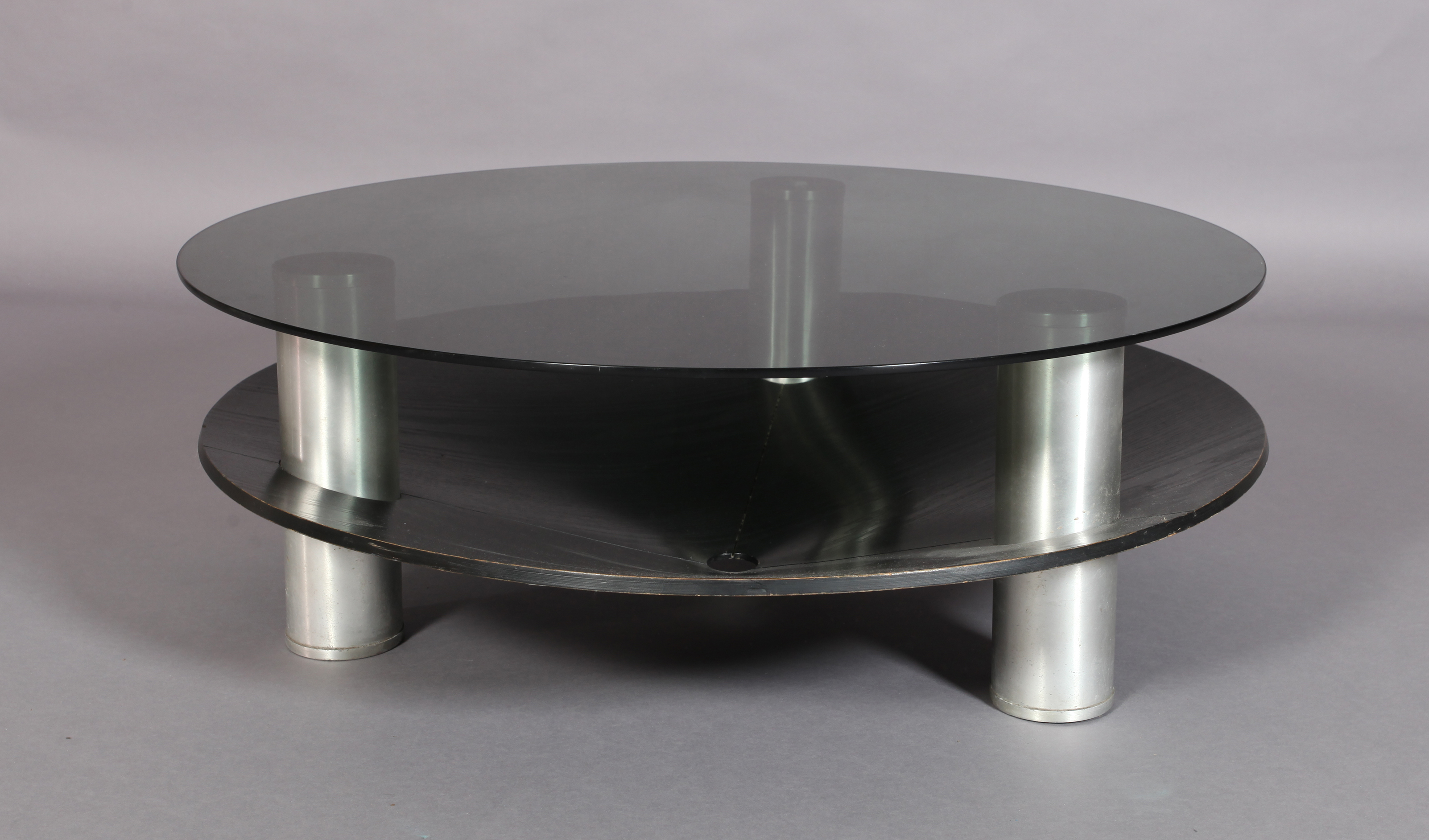 A circular two tier coffee table, the smoked glass top supported on three cylindrical aluminum - Image 2 of 4