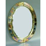 An oval wall mirror with raised mirror-panelled and gilt metal beaded surround, 82cm x 63cm