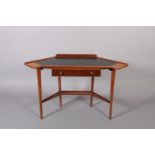 A mahogany corner desk having an incised leather-effect writing surface above a drawer with brass