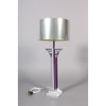 A perspex table lamp of column form, with purple, white and grey stripes to the column and flared
