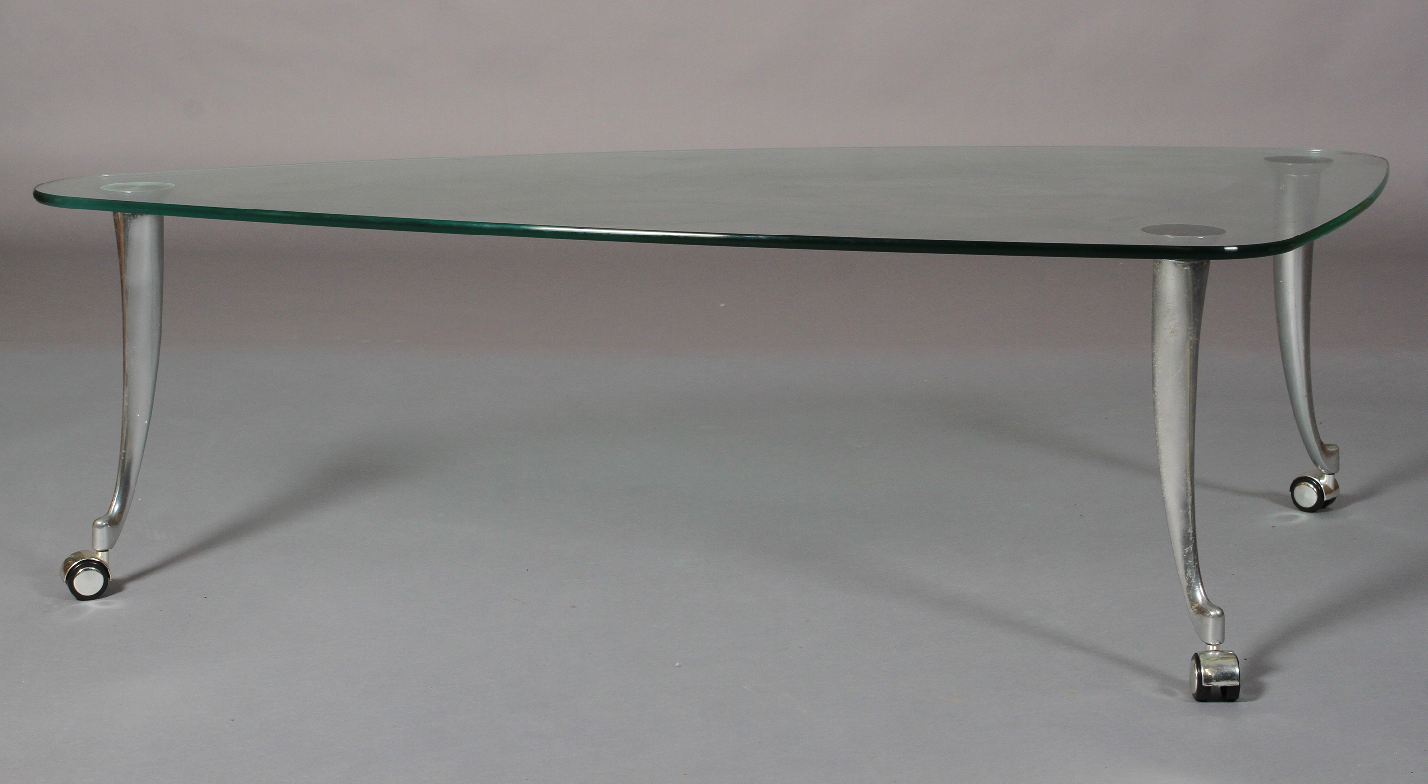 Rolf Benz - a glass and brushed aluminium coffee table, rounded triangular form on swept legs and - Image 2 of 5