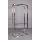A chrome and gilt metal display stand with three smoked glass shelves, 84cm wide x 41cm deep x 183cm