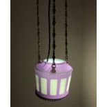 A late Victorian amethyst glass ceiling light pendant of cut cylindrical form with cone base hung on