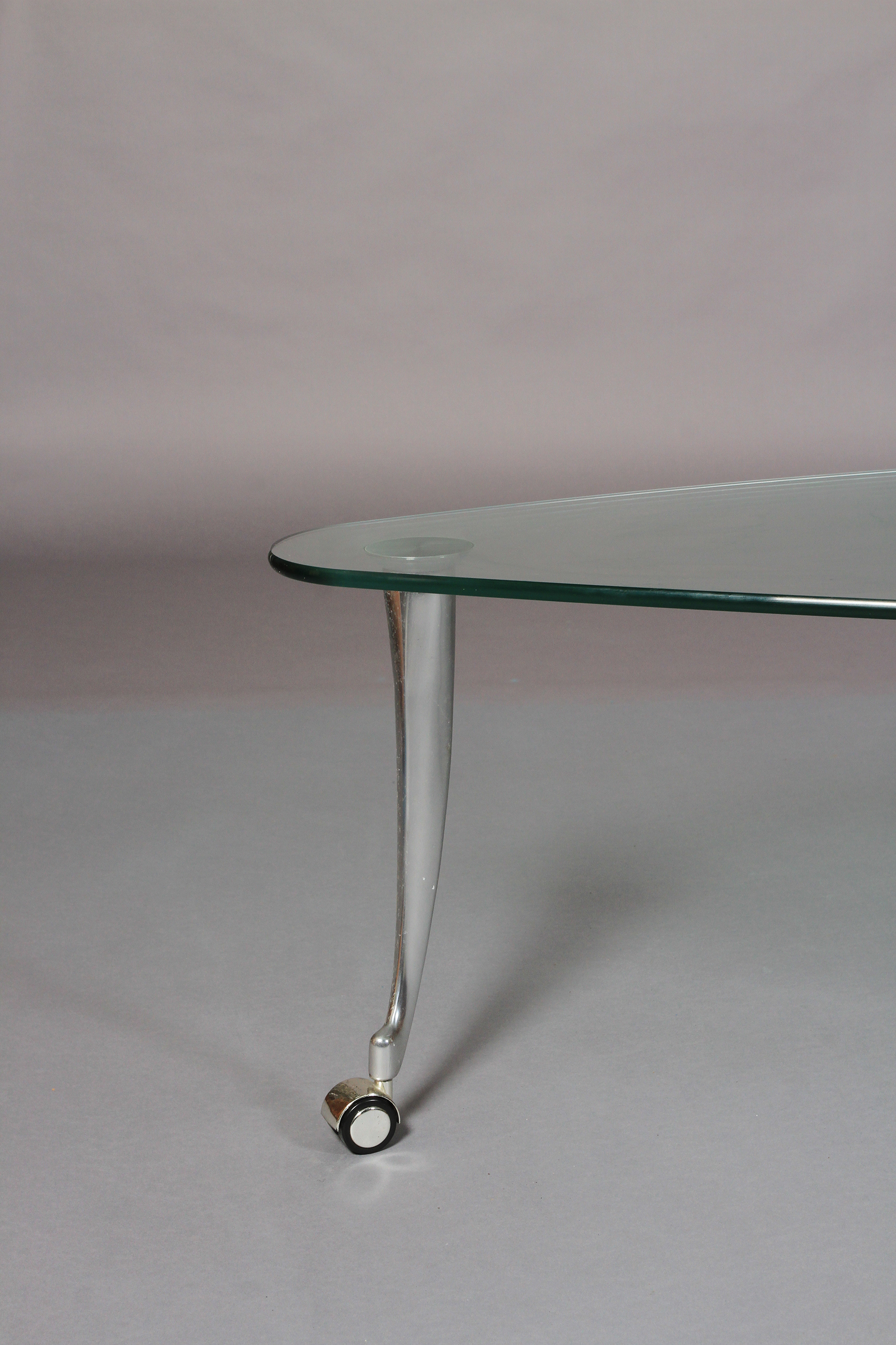 Rolf Benz - a glass and brushed aluminium coffee table, rounded triangular form on swept legs and - Image 3 of 5