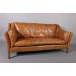 A tan leather two seater sofa by 'Halo' on square legs, 175cm wide x 62cm deep x 82cm high