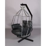 A vintage Ib Arberg (Sweden) hanging parrot chair with re-enamelled black metal stand, chromium