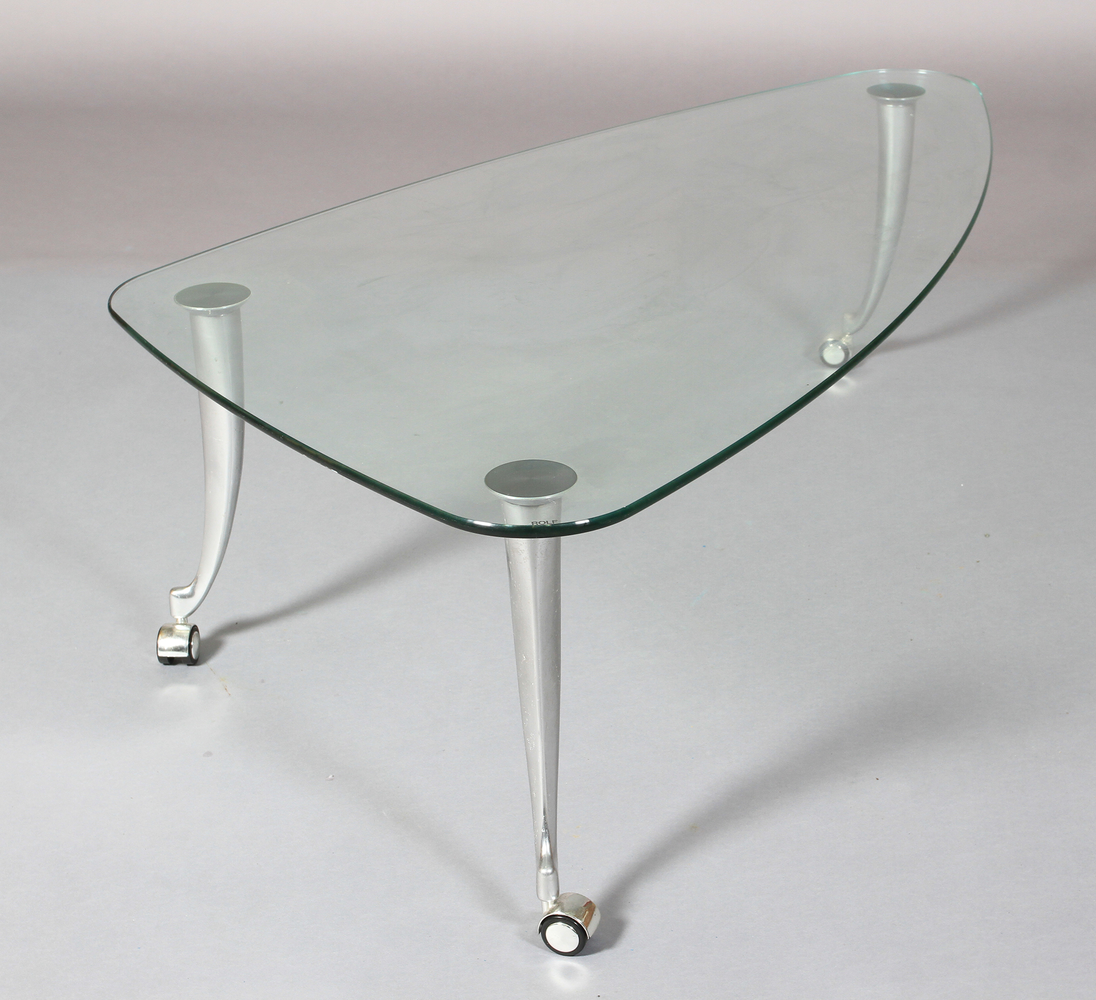 Rolf Benz - a glass and brushed aluminium coffee table, rounded triangular form on swept legs and - Image 5 of 5