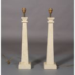 A pair of cast stone-effect table lamps of square tapered columns on square bases, 71cm high