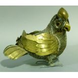 A vintage cut steel and stamped brass parrot in the style of Sergio Bustamante (Mexico), the body