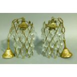 A pair of gilt metal cylindrical trellis pendant light fittings c.1950/60's with flower finials