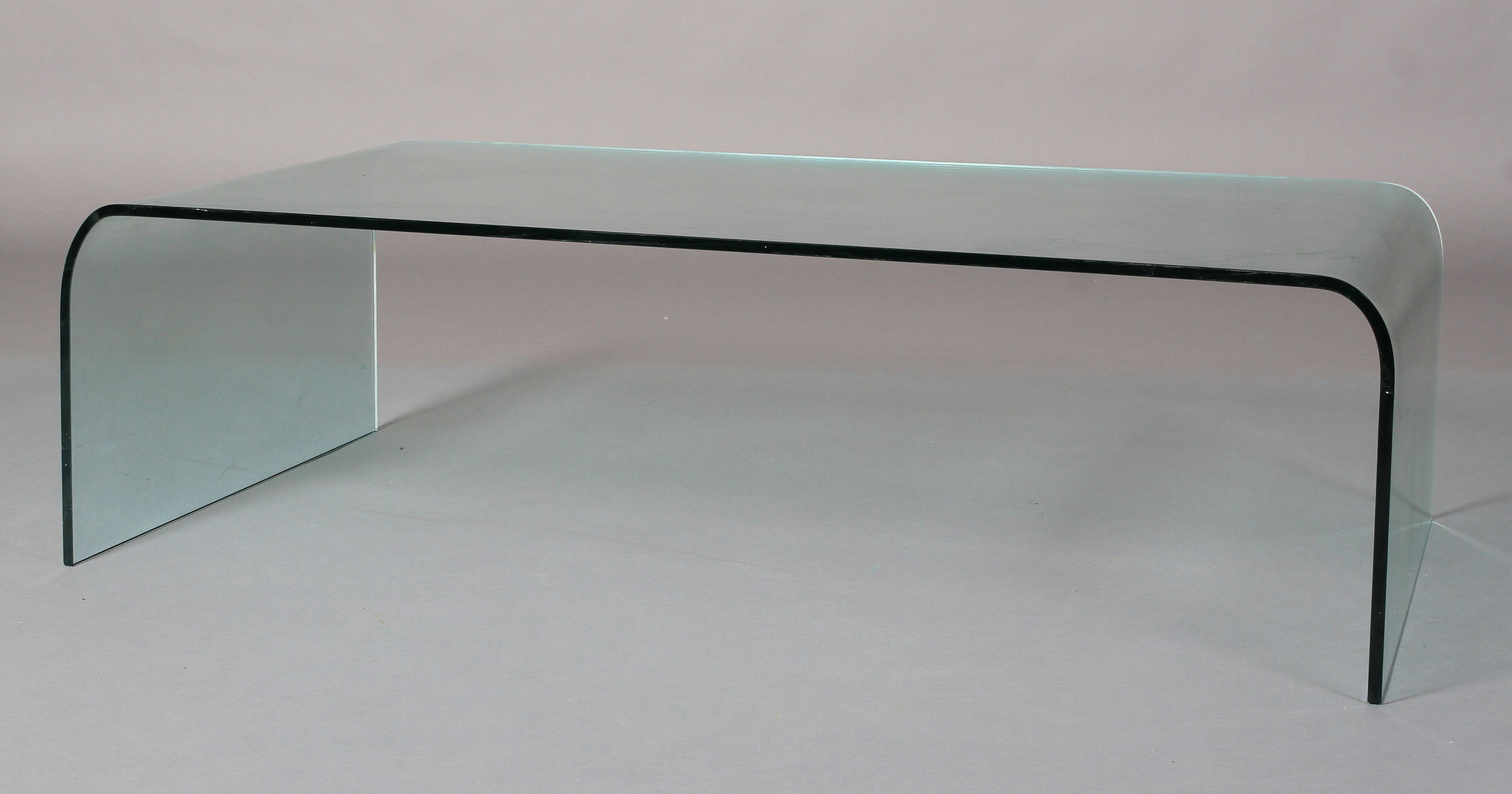 A curved glass coffee table 130cm long x 69cm wide x 38cm high - Image 2 of 2