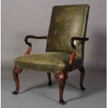 A George III style mahogany stained and green leather elbow chair, close studded with shepherd's