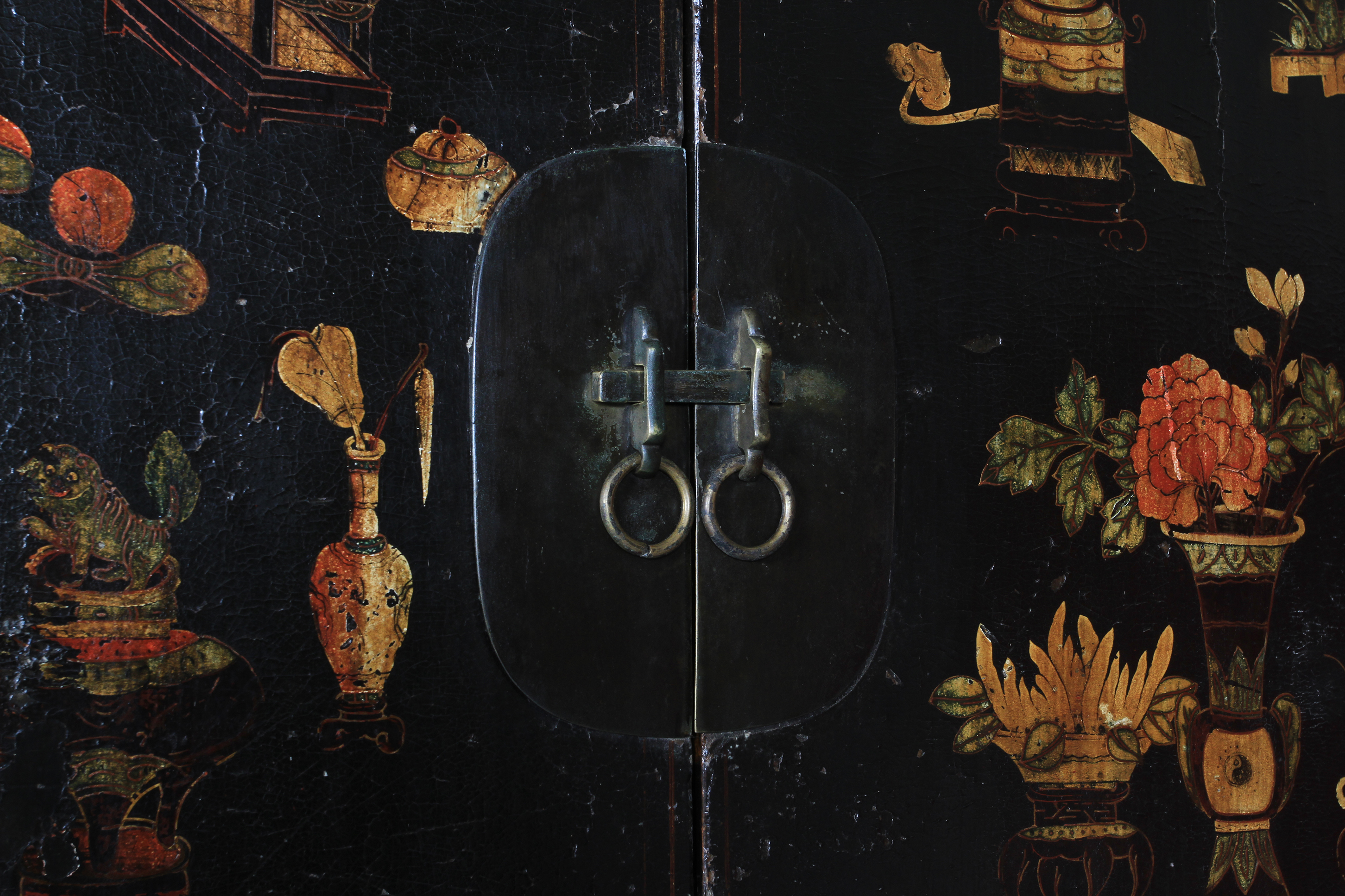 A Chinoiserie ebonised cabinet having two doors above a panel decorated with archaic symbols, the - Image 2 of 11