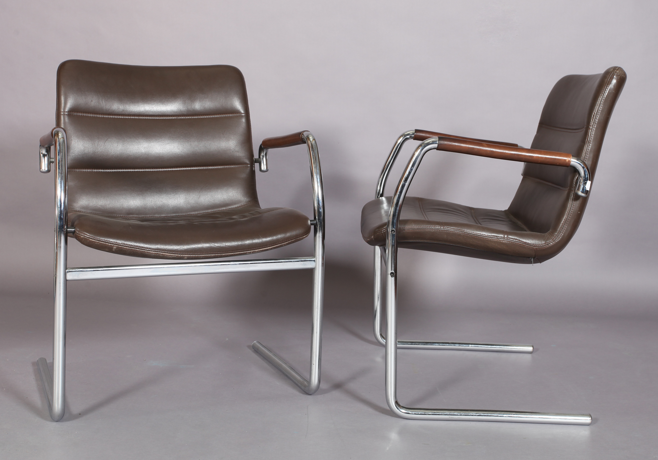 A pair of brown leather and tubular chrome cantilever armchairs c.1970/80s